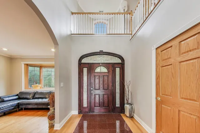 a view of a livingroom with furniture and a window