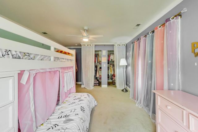 a kitchen with a sink and wooden floor
