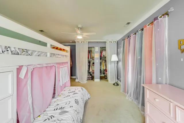 a kitchen with a sink and wooden floor