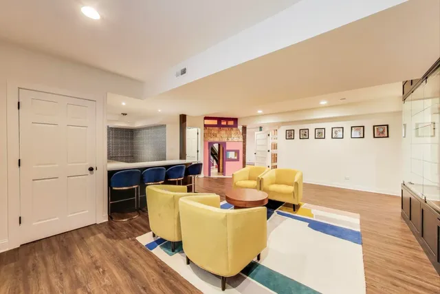 a living room with furniture and a night stand
