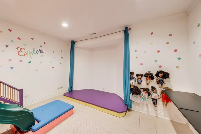 a view of a patio with table and chairs potted plants and a large tree