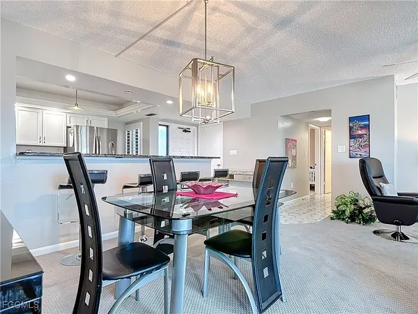 a kitchen with stainless steel appliances kitchen island granite countertop a sink and cabinets