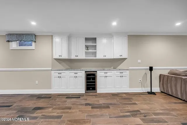 a kitchen with granite countertop a stove and a sink