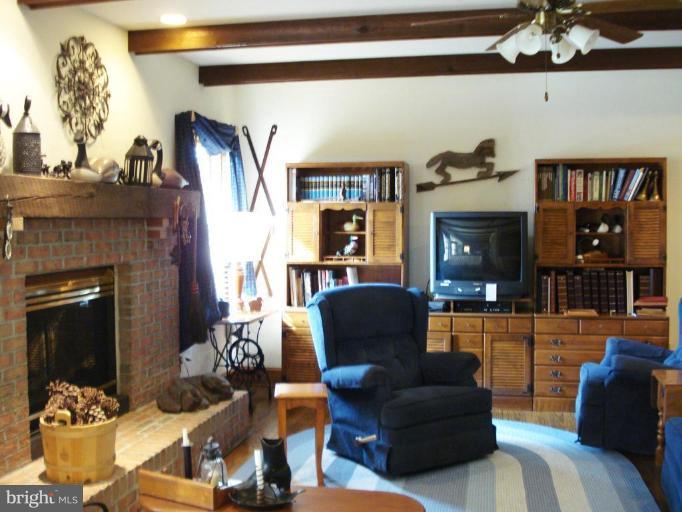 2830 Sommersby Road Mount Airy, MD 21771 - Photo 11 of 29 Family Room with Gas Fireplace and Pine flooring