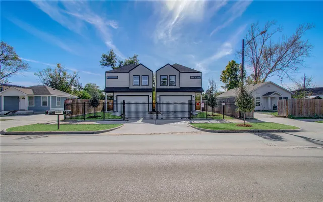 a view of street with houses in the background
