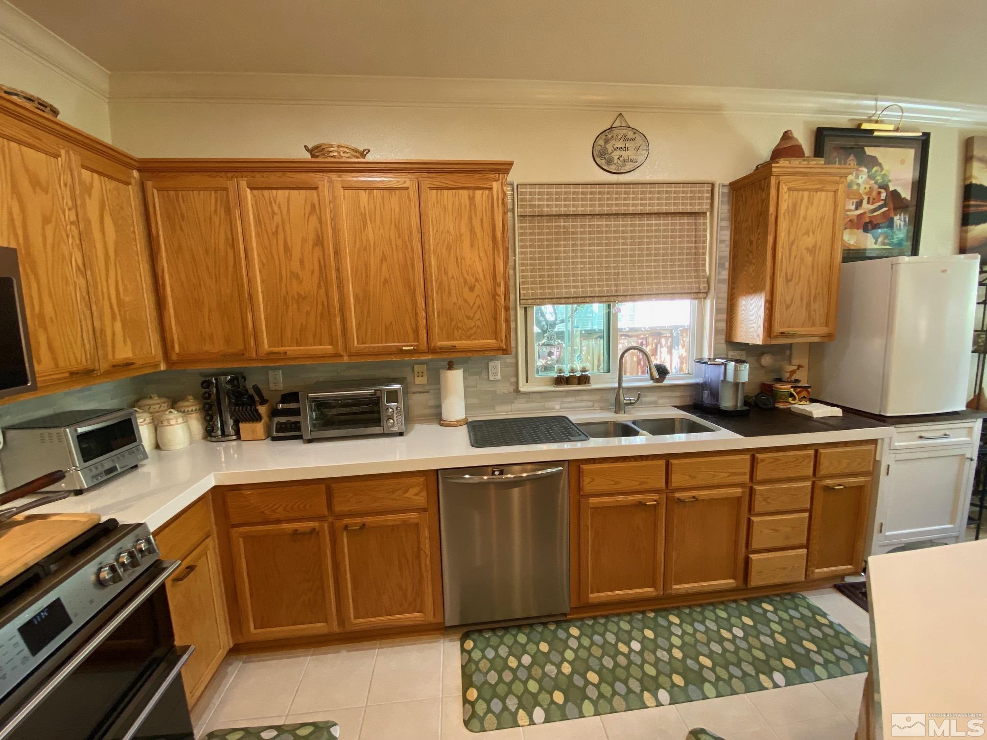 7875 Morgan Pointe Circle Reno, NV 89523 - Photo 12 of 31 a kitchen with a sink cabinets and window