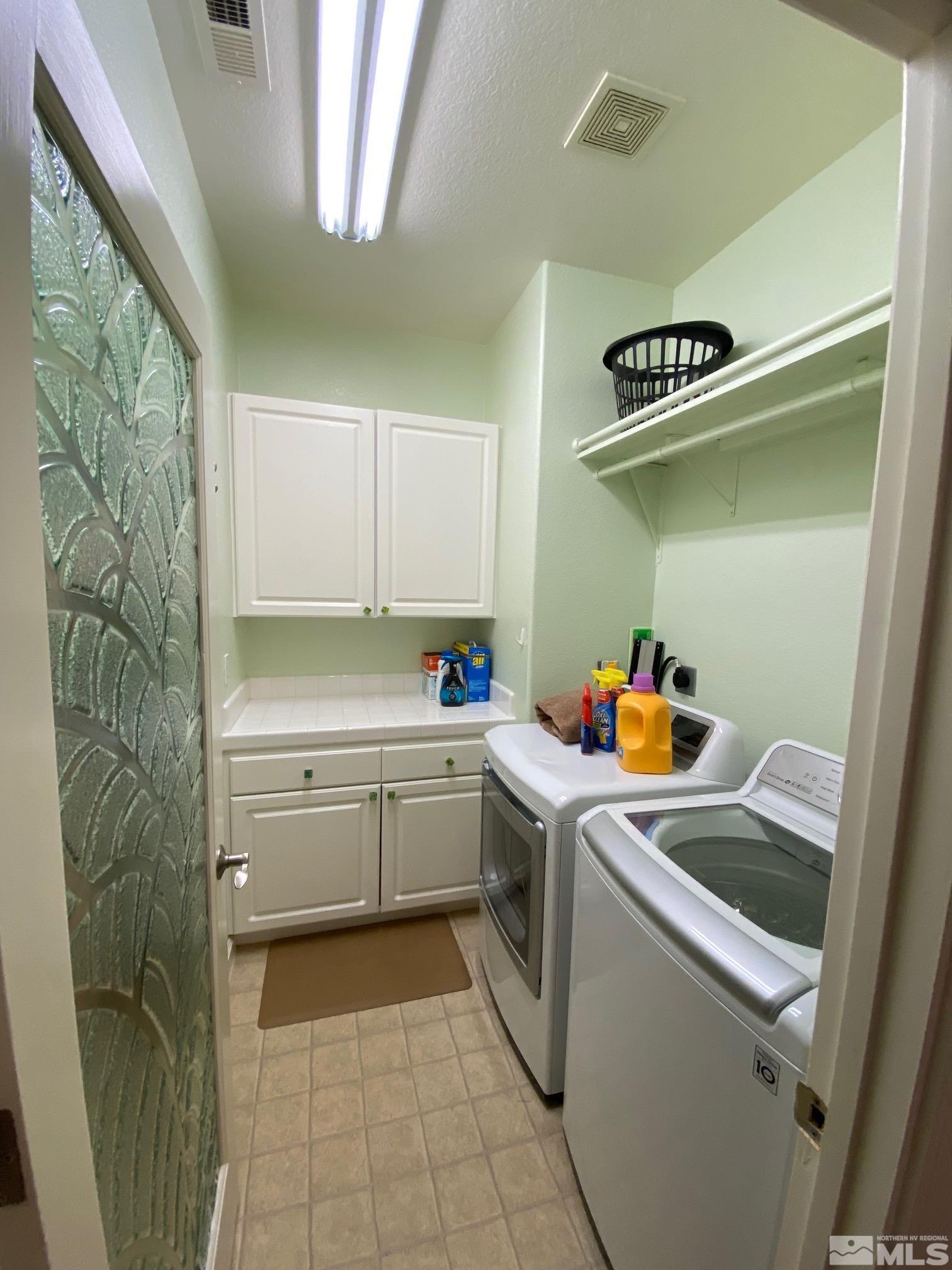 7875 Morgan Pointe Circle Reno, NV 89523 - Photo 17 of 31 a kitchen with a sink and cabinets