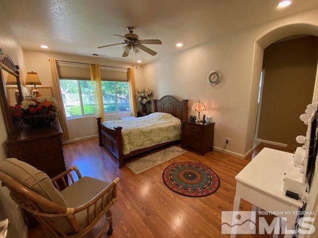 7875 Morgan Pointe Circle Reno, NV 89523 - Photo 19 of 31 a bedroom with furniture and a large window