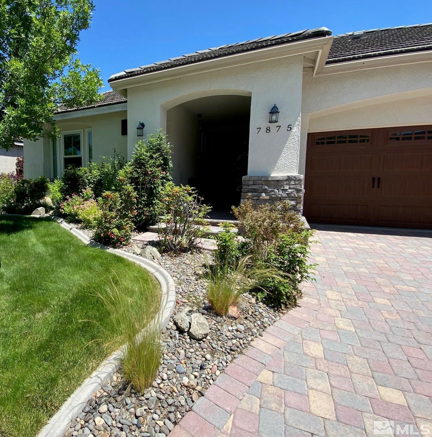 7875 Morgan Pointe Circle Reno, NV 89523 - Photo 2 of 31 a front view of a house with a yard