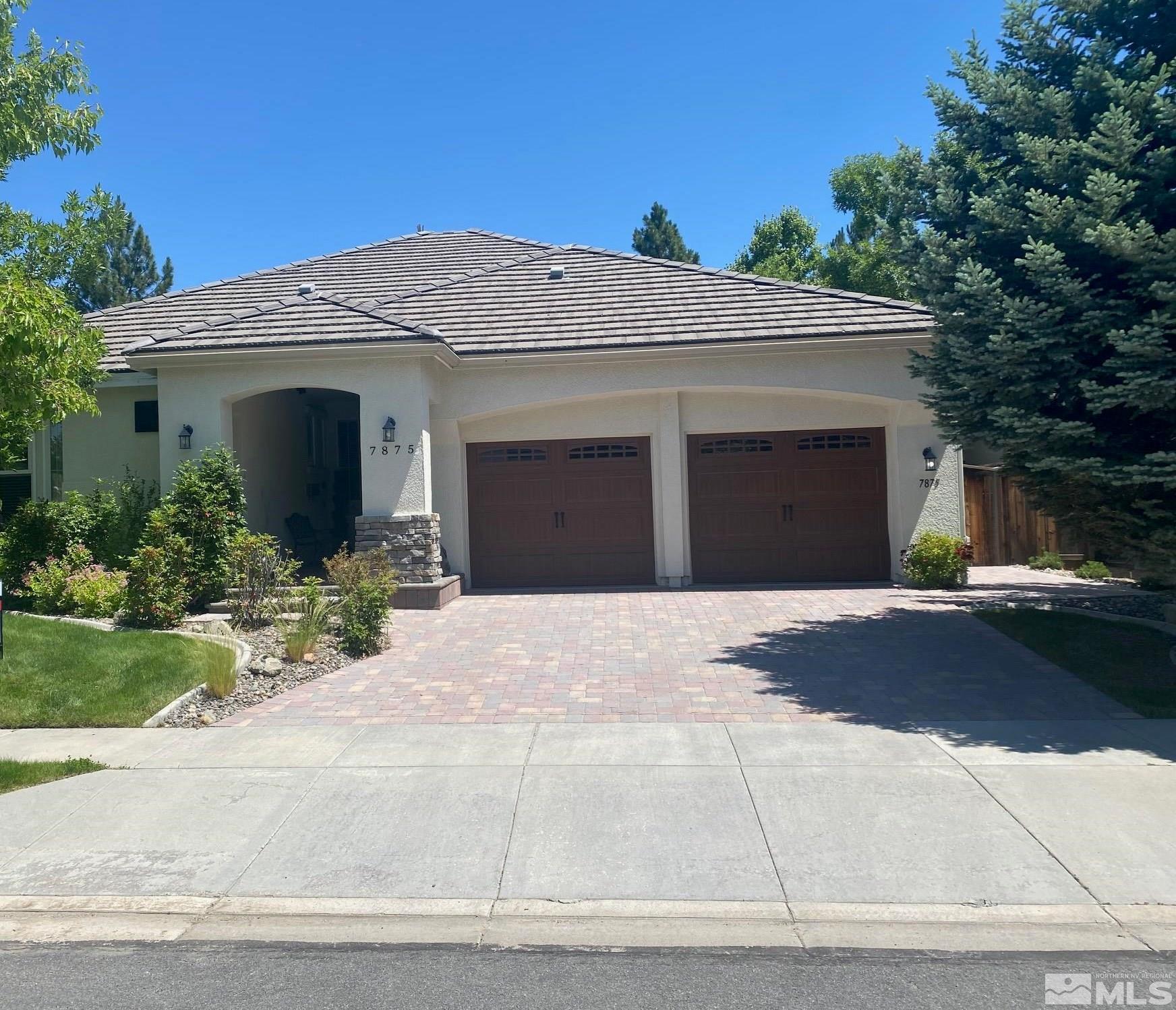 7875 Morgan Pointe Circle Reno, NV 89523 - Photo 3 of 31 a front view of a house with a yard and garage
