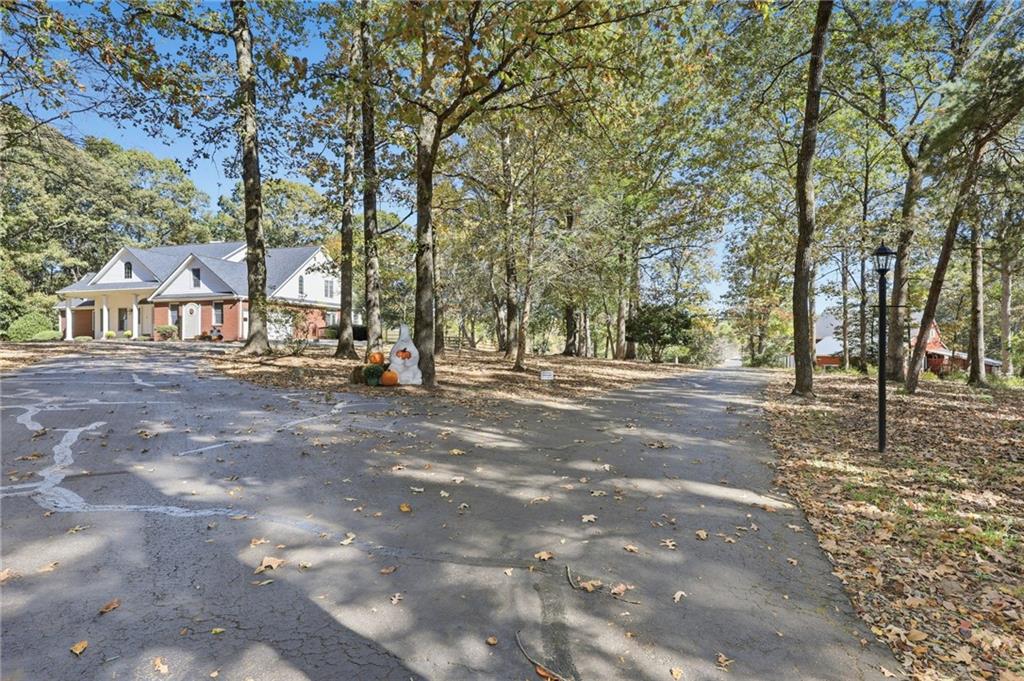 6752 Shoal Creek Road Clermont, GA 30527 - Photo 26 of 65 a view of road with trees