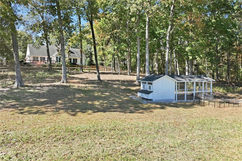 6752 Shoal Creek Road Clermont, GA 30527 - Photo 33 of 65 a view of a house with a yard