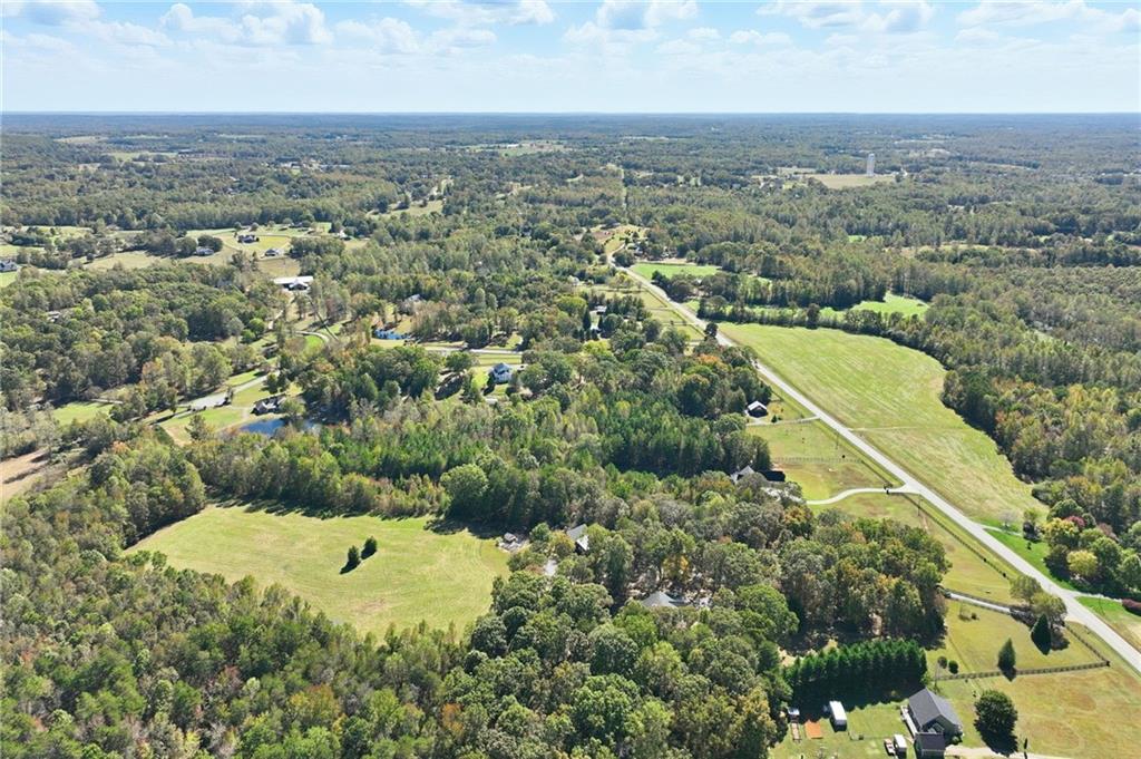 6752 Shoal Creek Road Clermont, GA 30527 - Photo 46 of 65 an aerial view of a residential houses with outdoor space and trees