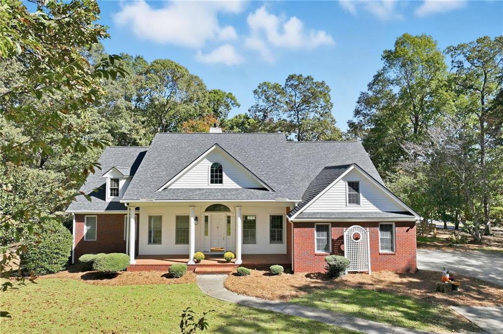 6752 Shoal Creek Road Clermont, GA 30527 - Photo 55 of 65 a front view of a house with a yard