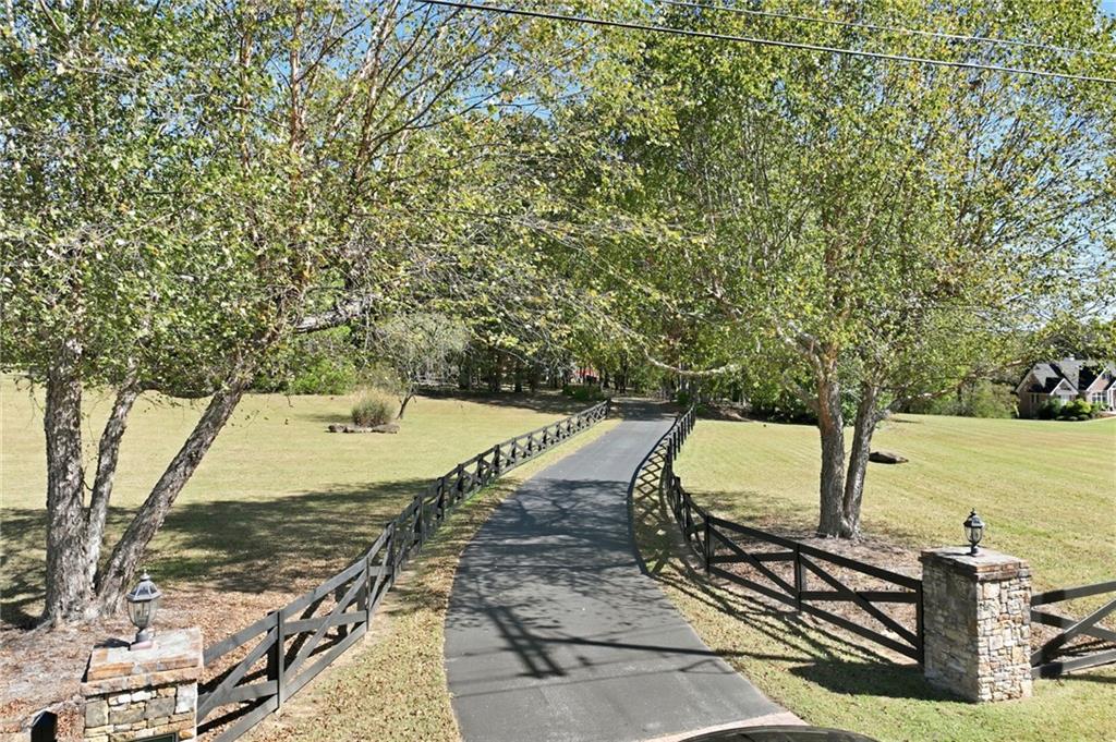 6752 Shoal Creek Road Clermont, GA 30527 - Photo 57 of 65 a view of a swimming pool with a patio