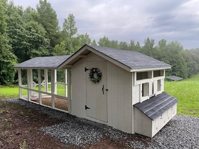 6752 Shoal Creek Road Clermont, GA 30527 - Photo 65 of 65 a front view of a house with garden