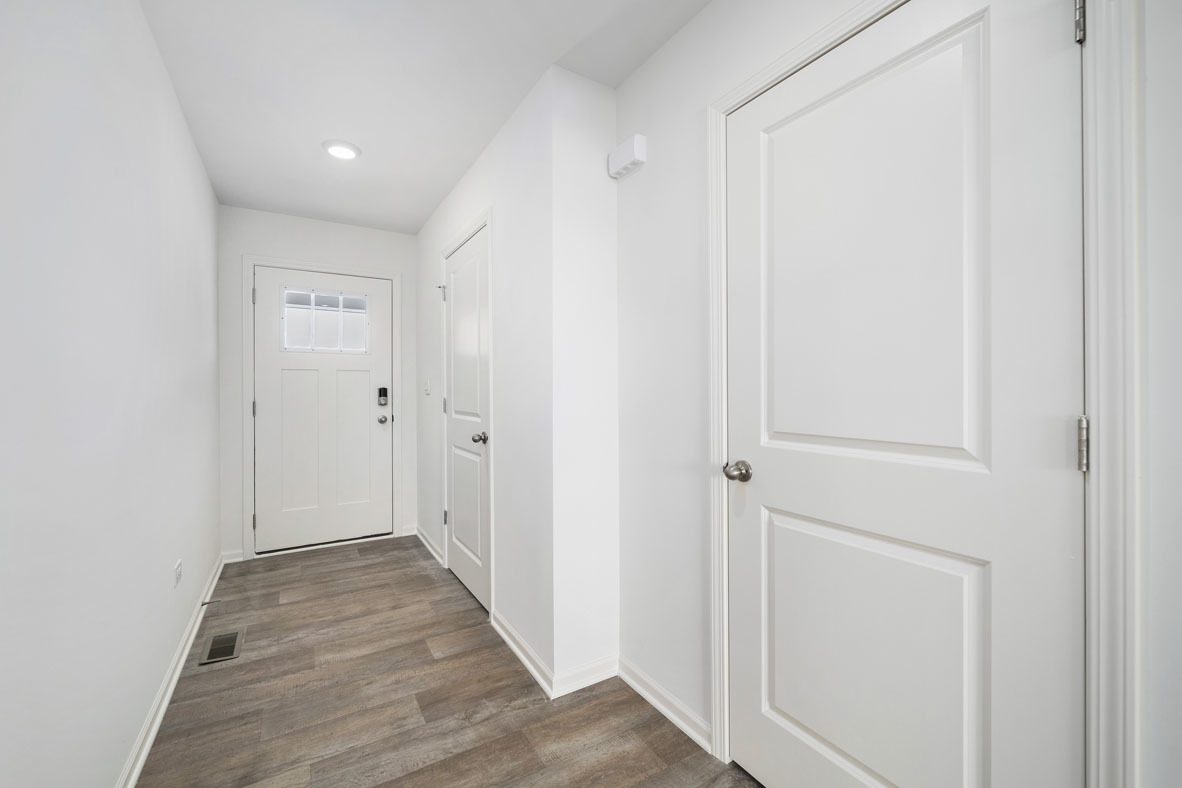 3719 Monte Carlo Way Joliet, IL 60421 - Photo 23 of 32 a view of a hallway with wooden floor