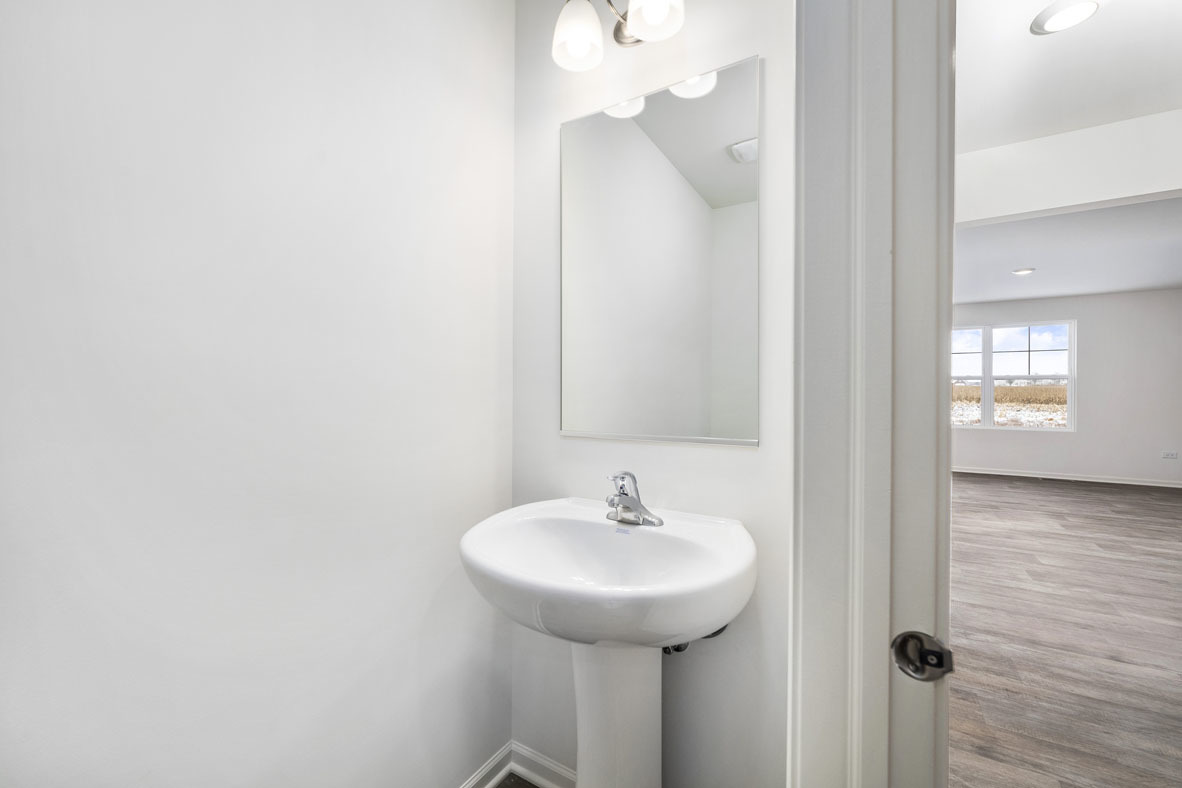 3719 Monte Carlo Way Joliet, IL 60421 - Photo 24 of 32 a bathroom with a sink and a mirror