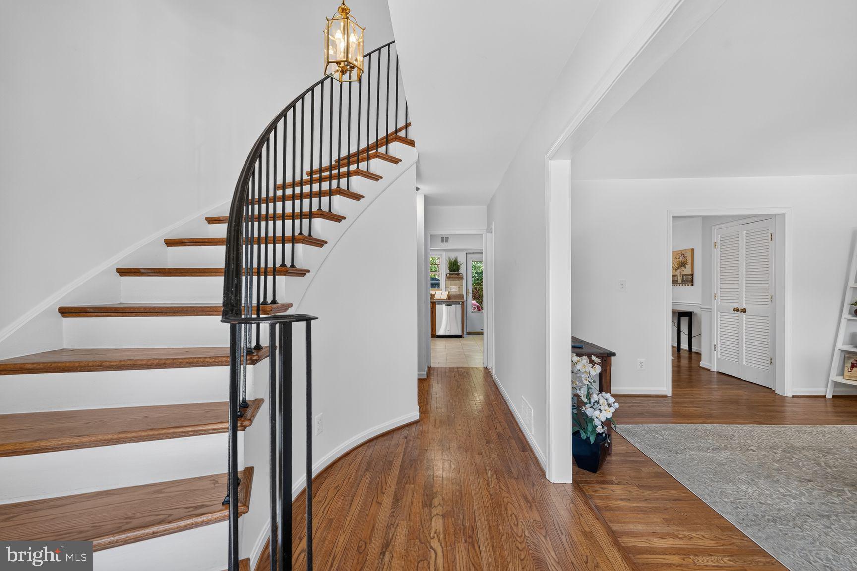 8312 Wickham Road Springfield, VA 22152 - Photo 2 of 49 Signature curved stairway entry