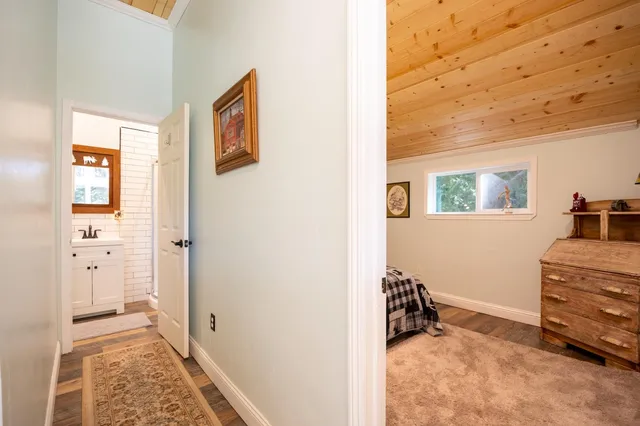 a view of a bedroom with closet and windows