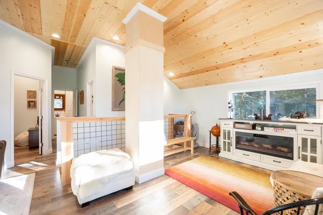 a bedroom with furniture and a fireplace