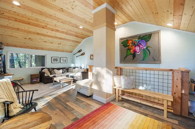 a living room with furniture and a rug