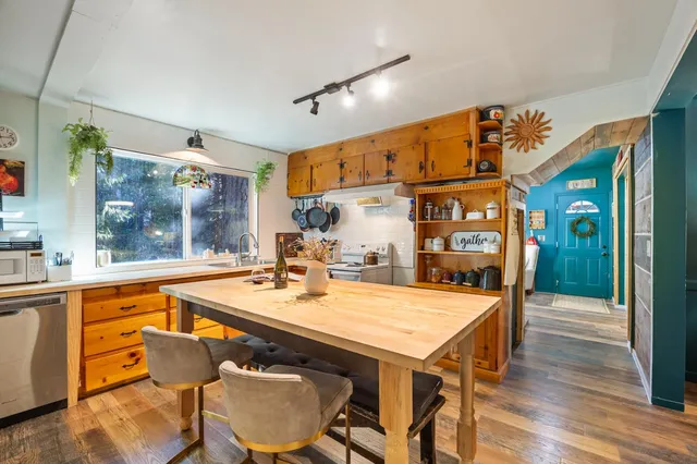 a dinning table and chairs in a room