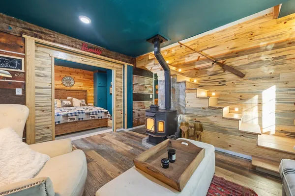 a living room with a bed and furniture