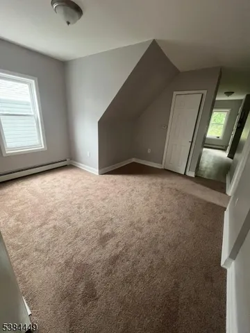 a view of an empty room with windows