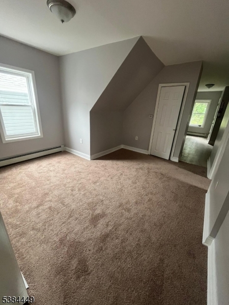 171 Seymour Avenue, Unit 3 Newark, NJ 07108 - Photo 4 of 9 a view of an empty room with windows