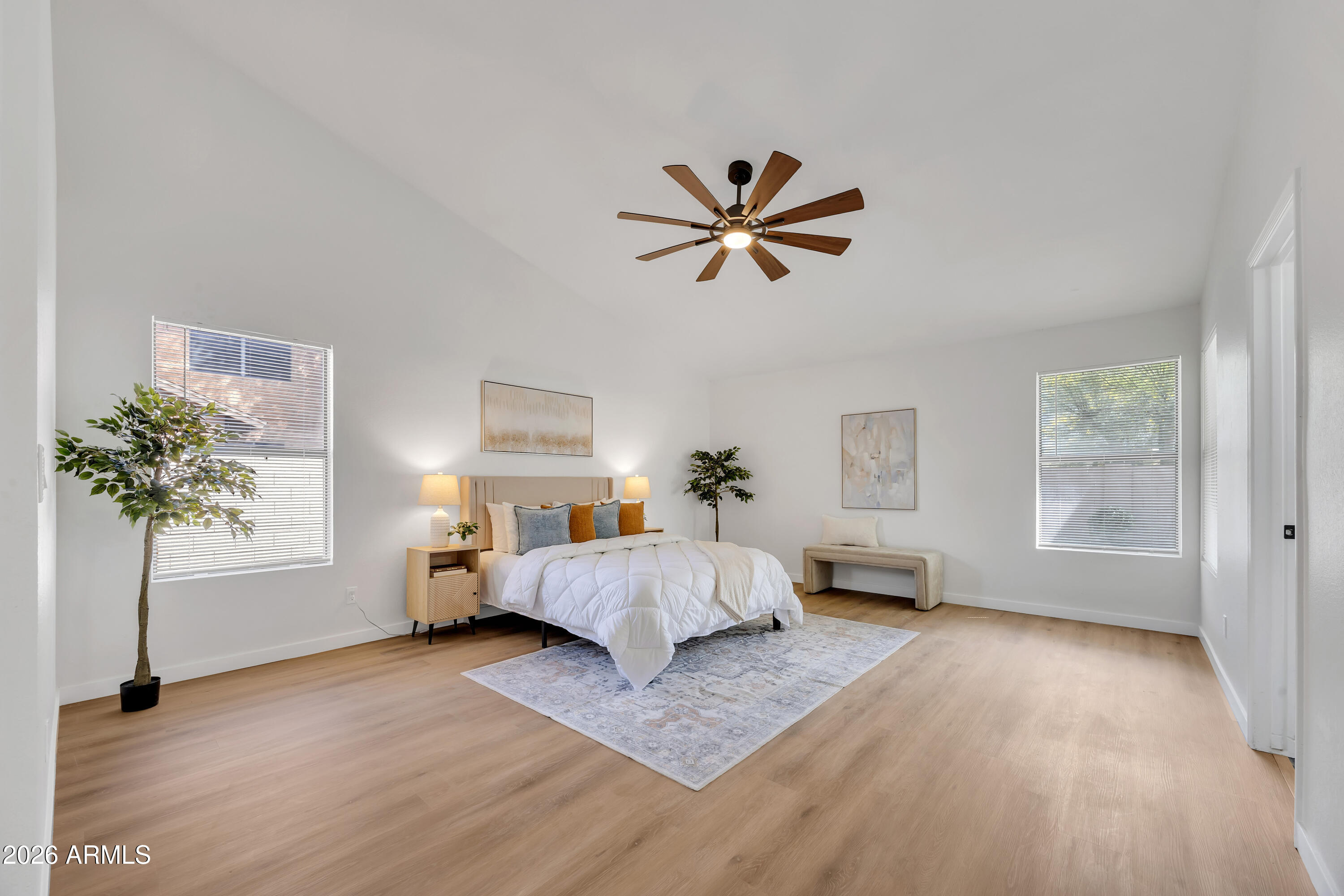 613 West Tara Court Gilbert, AZ 85233 - Photo 14 of 25 a bed room with a bed and a chandelier