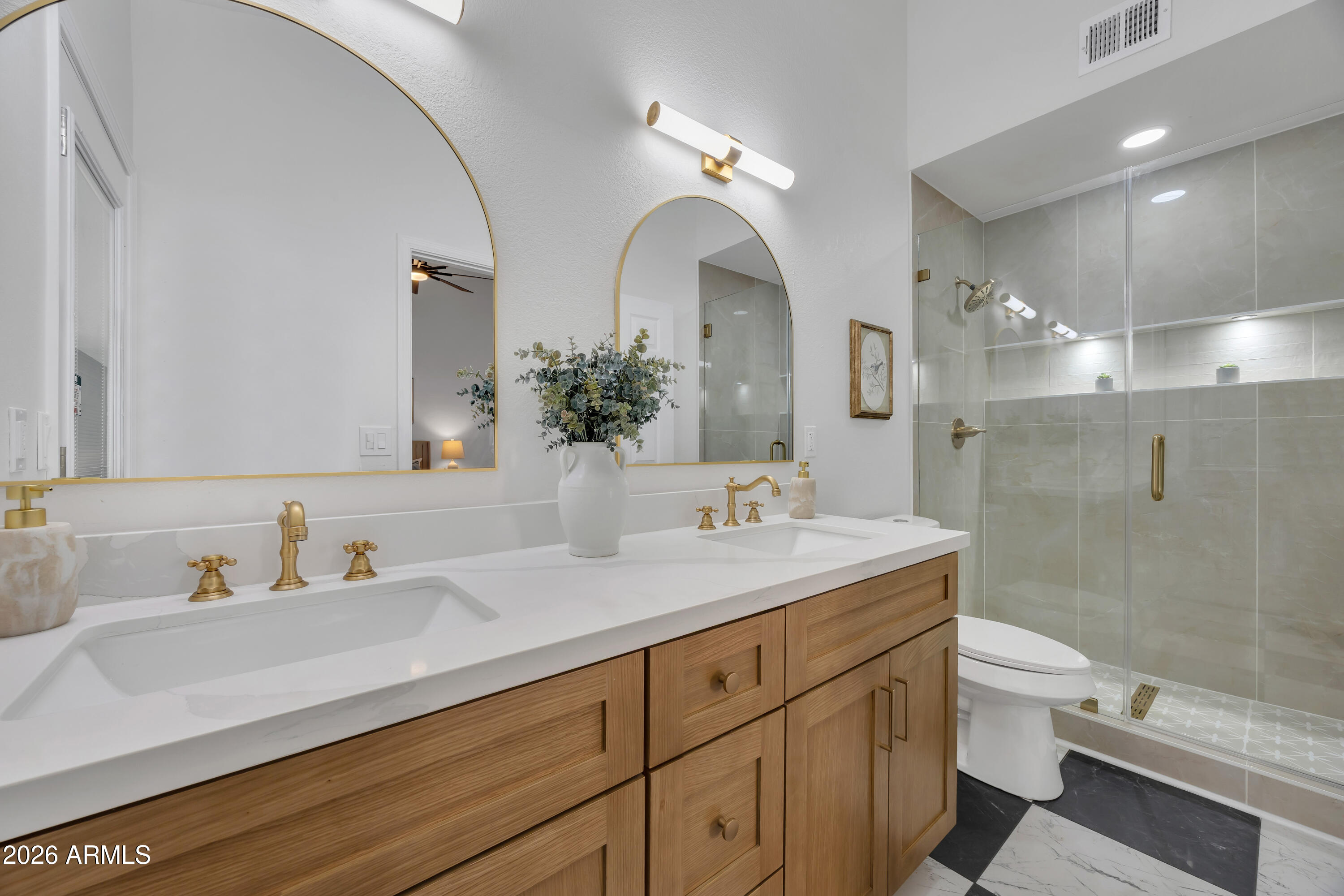613 West Tara Court Gilbert, AZ 85233 - Photo 16 of 25 a bathroom with a sink a toilet and a large mirror