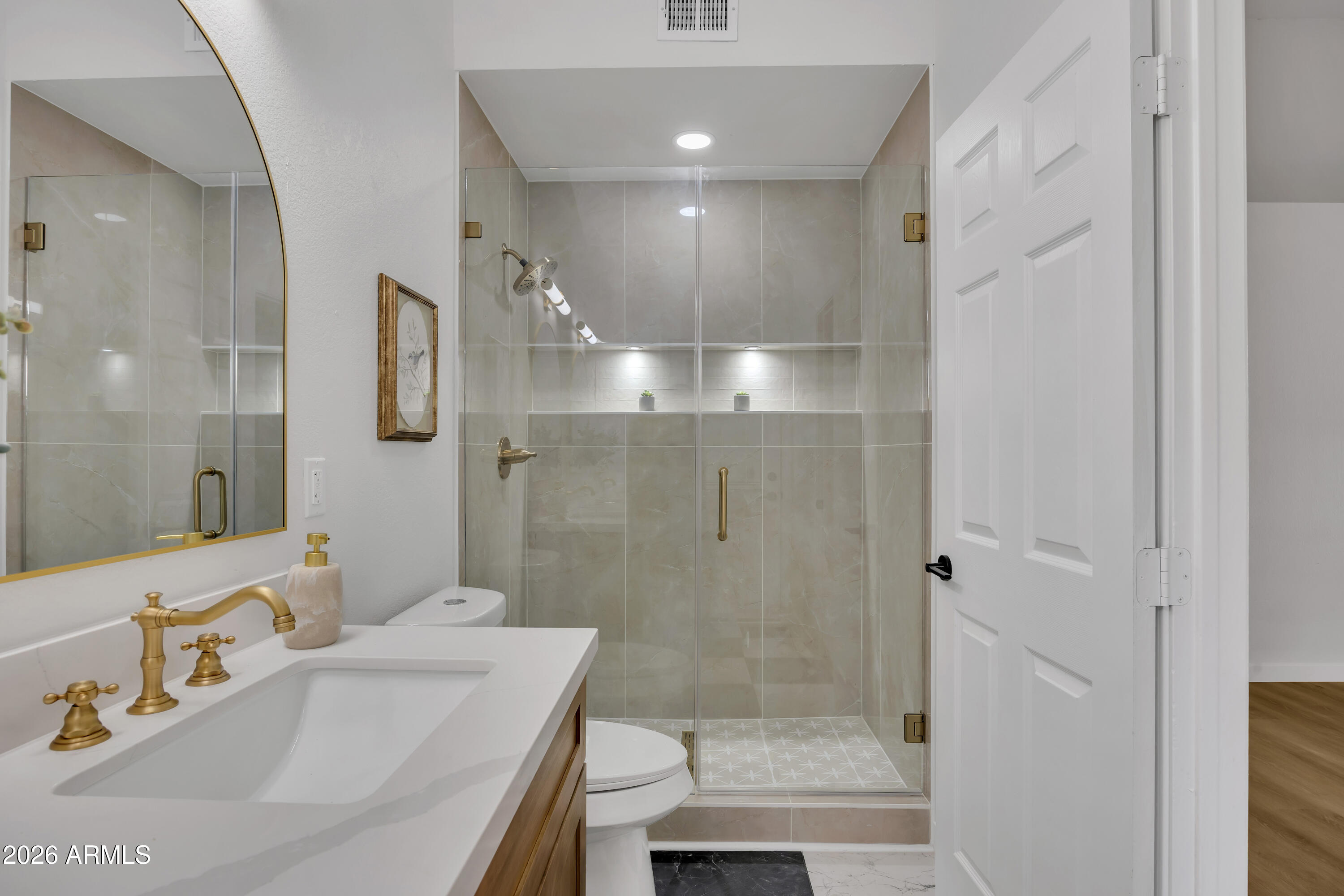 613 West Tara Court Gilbert, AZ 85233 - Photo 17 of 25 a bathroom with a sink a toilet and shower