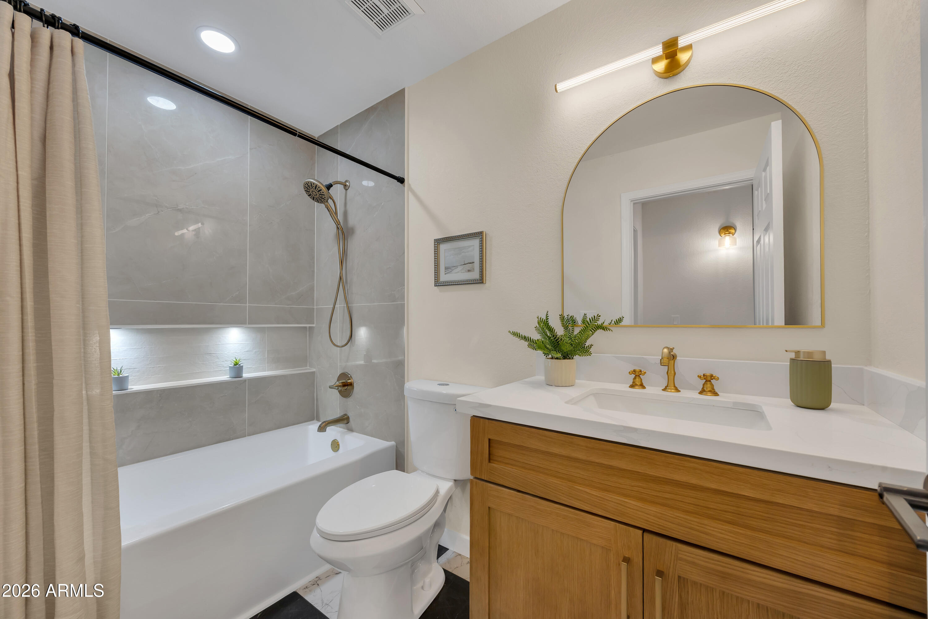 613 West Tara Court Gilbert, AZ 85233 - Photo 20 of 25 a bathroom with a sink a toilet and shower