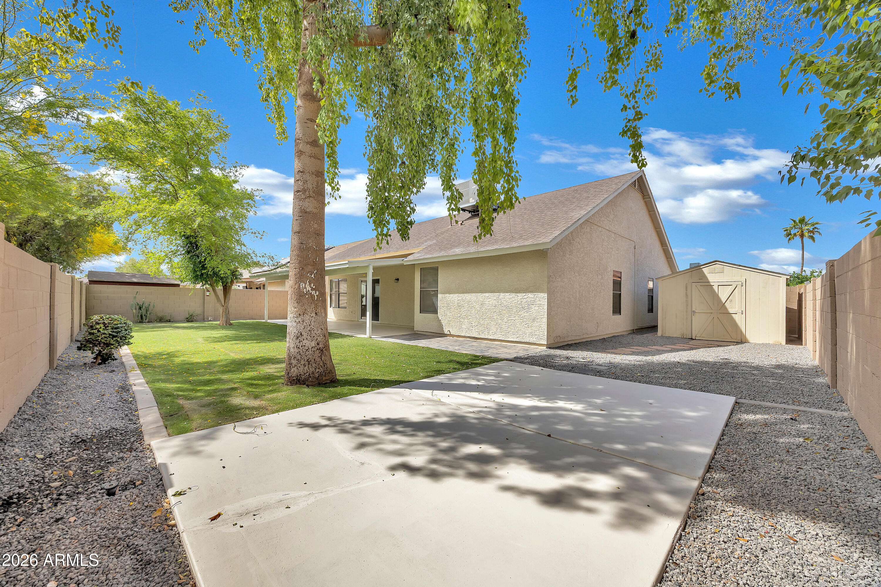 613 West Tara Court Gilbert, AZ 85233 - Photo 23 of 25 a view of a house with a yard and tree s