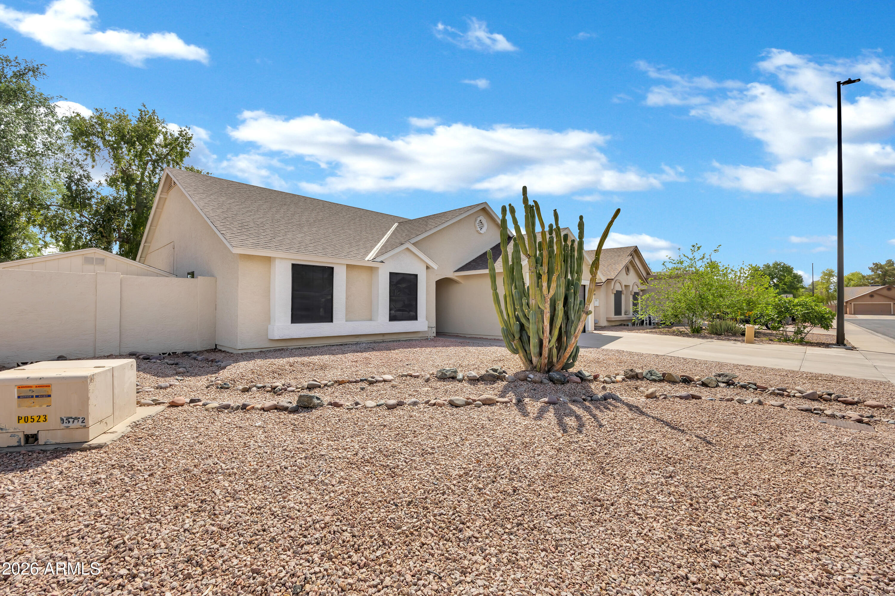 613 West Tara Court Gilbert, AZ 85233 - Photo 3 of 25 a view of a house with a backyard space