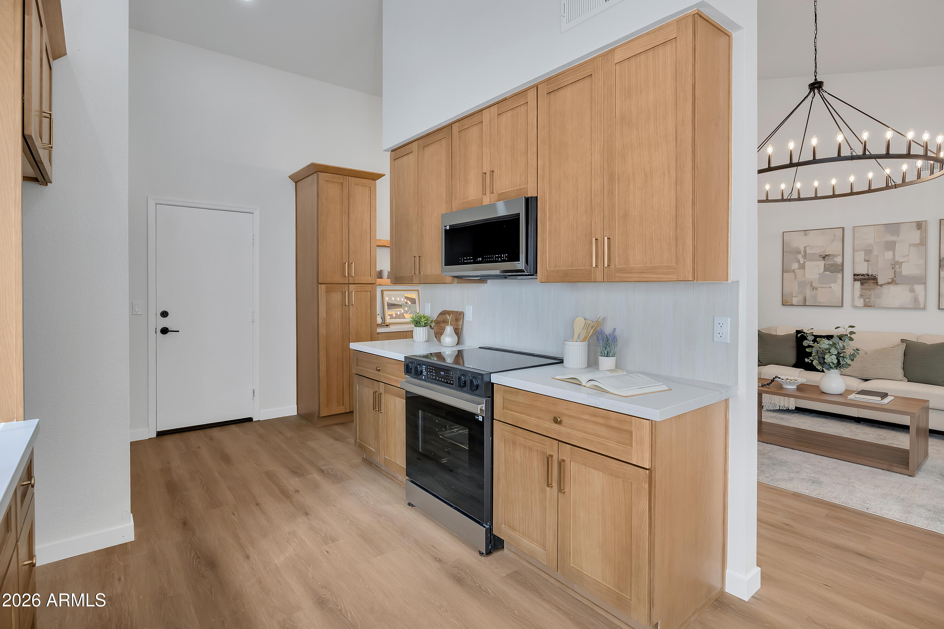 613 West Tara Court Gilbert, AZ 85233 - Photo 10 of 25 a kitchen with a sink cabinets and wooden floor