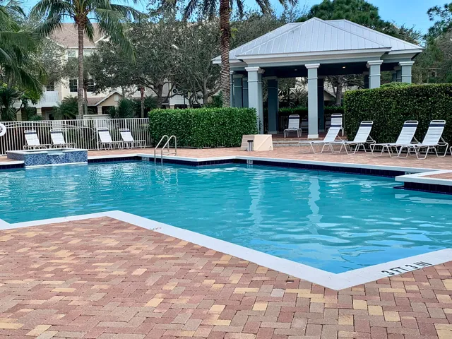 a view of a swimming pool with a patio