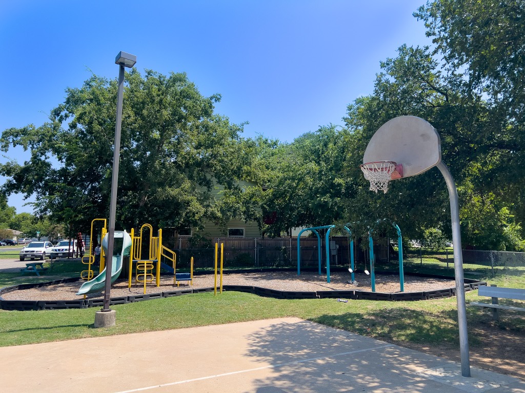 9703 Roxanna Drive, Unit D Austin, TX 78748 - Photo 12 of 24 View of communal playground and basketball courts