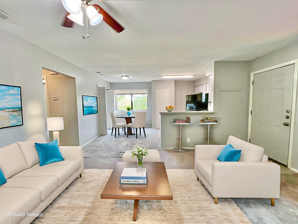 9703 Roxanna Drive, Unit D Austin, TX 78748 - Photo 3 of 24 Living area featuring carpet floors and a ceiling fan