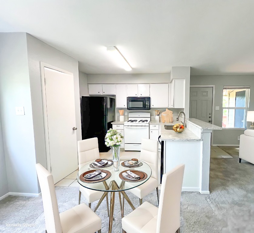 9703 Roxanna Drive, Unit D Austin, TX 78748 - Photo 4 of 24 Dining space with baseboards and light colored carpet