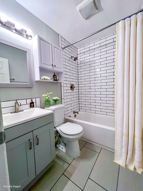 9703 Roxanna Drive, Unit D Austin, TX 78748 - Photo 6 of 24 Bathroom featuring shower / bath combination with curtain, vanity, and light tile patterned floors = staged