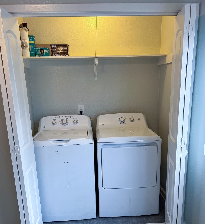 9703 Roxanna Drive, Unit D Austin, TX 78748 - Photo 9 of 24 Laundry room with washing machine and clothes dryer