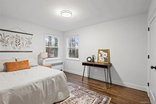 a bedroom with a bed and a table in it