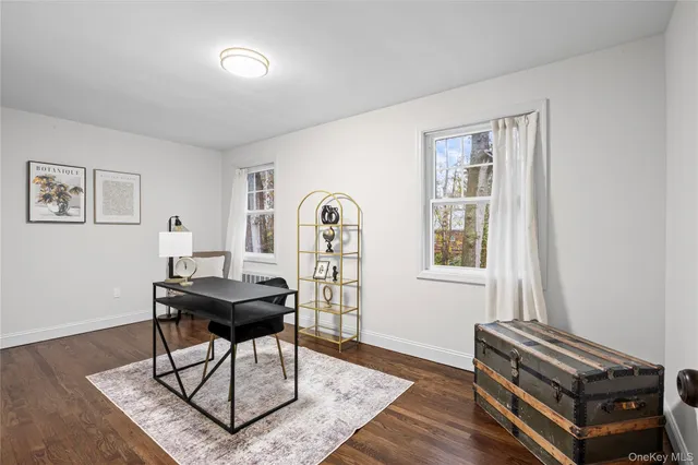 a work room with furniture and wooden floor