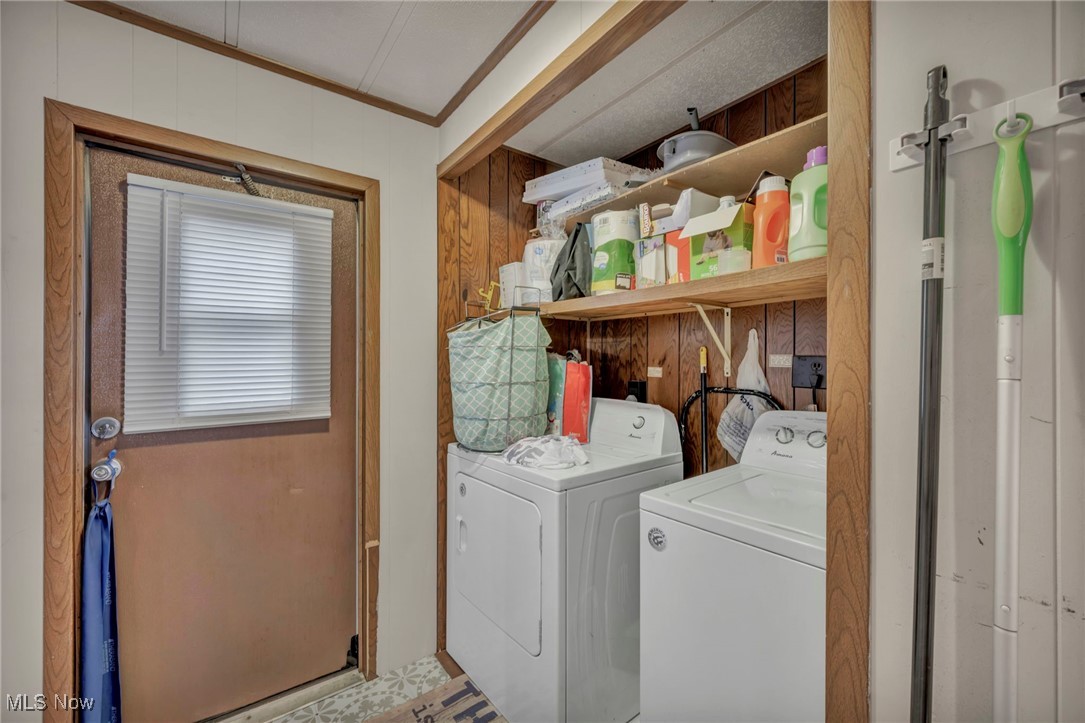 35157 Center Ridge Road, Unit 126 North Ridgeville, OH 44039 - Photo 42 of 50 Laundry area with crown molding, independent washer and dryer, and wood walls