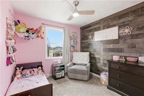 a bedroom with furniture and a window