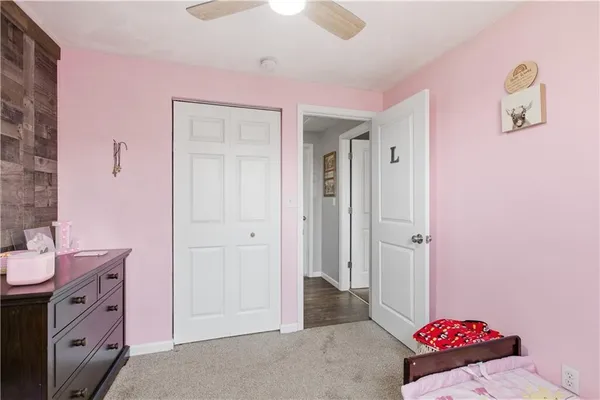 a spacious bathroom with a sink and a mirror