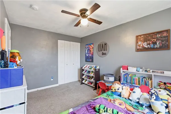 a bedroom with furniture and a wooden floor