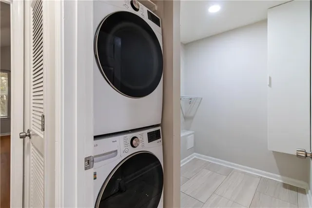 a view of a hallway with washer and dryer
